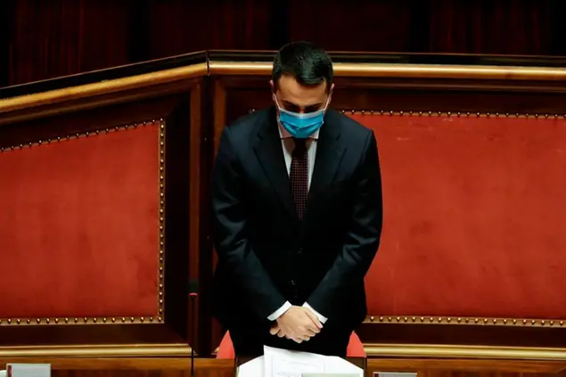 Italian Foreign Minister Luigi di Maio observes a minute of silence as he addresses the Senate on Monday's killing in the Democratic Republic of Congo of the Italian ambassador Luca Attanasio, an Italian Carabinieri police officer and their Congolese driver, in Rome, Wednesday, Feb. 24, 2021. Di Maio told lawmakers in Rome that Italy has asked both the United Nations and the U.N. World Food Program to open an investigation into the security arrangements for the U.N. food aid convoy in Congo which they were traveling in. (AP Photo/Andrew Medichini, Pool)