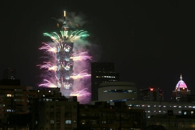 Fireworks detonate from the Taipei 101 building during the New Year's celebrations in Taipei, Taiwan, Friday, Jan. 1, 2021. (AP Photo/Chiang Ying-ying)