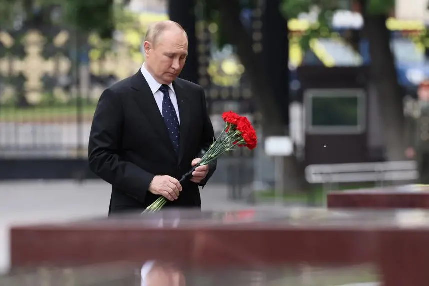Russian President Vladimir Putin lays flowers at the Hero Cities memorial plates during a wreath laying ceremony at the Tomb of Unknown Soldier in Moscow, Russia, Wednesday, June 22, 2022, marking the 81st anniversary of the Nazi invasion of the Soviet Union. (Mikhail Metzel, Sputnik, Kremlin Pool Photo via AP)