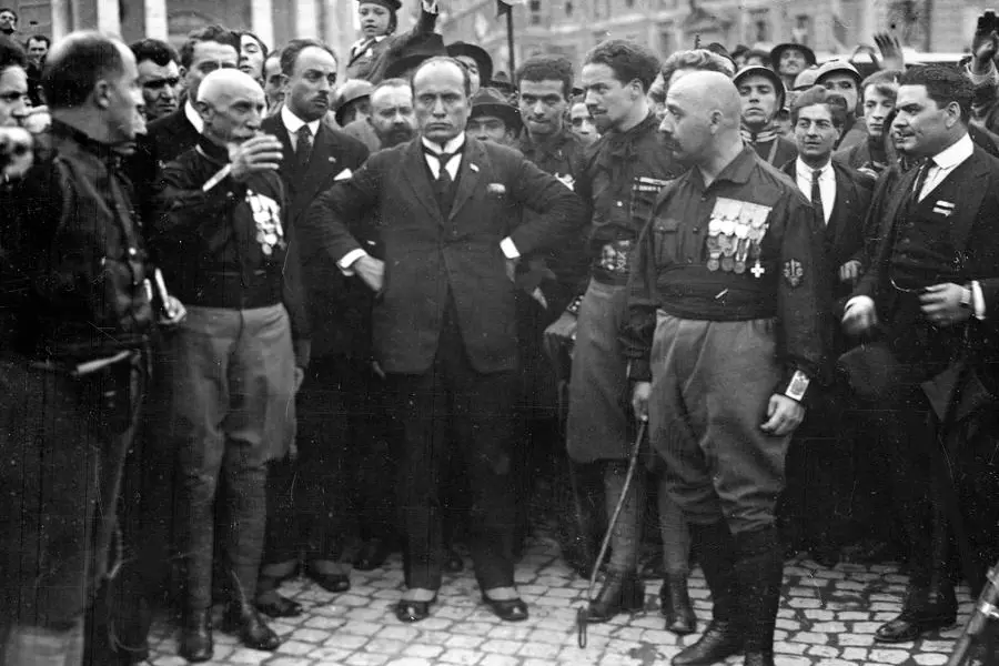 Italian Fascist leader Benito Mussolini, centre, hands on hips, with members of the fascist Party, in Rome, Italy, Oct. 28, 1922, following their March on Rome. Following the march King Emanuelle III asked Mussolini to form a new government. (AP Photo)