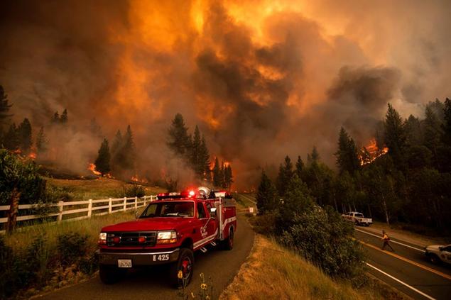Firefighters battle the Tamarack Fire in the Markleeville community of Alpine County, Calif., on Saturday, July 17, 2021. (AP Photo/Noah Berger)