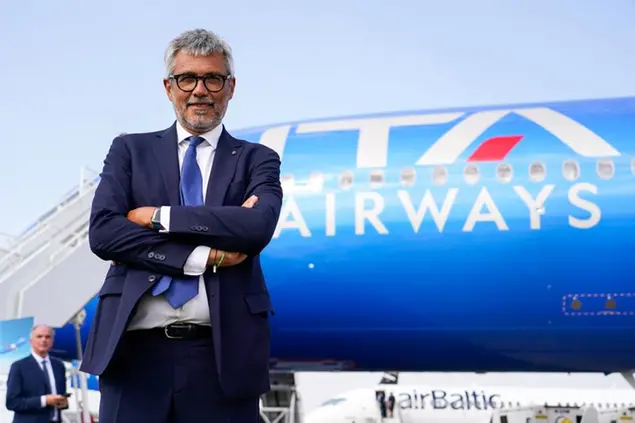 IMAGE DISTRIBUTED FOR ITA AIRWAYS - Fabio Lazzerini, CEO, ITA Airways, poses for a photograph next to the airline's flagship aircraft during the Farnborough International Airshow (FIA) on Tuesday, July 19, 2022, in Farnborough, United Kingdom. The 2022 FIA is the first airshow after the pandemic and the first ever for ITA Airways. ITA Airways showcased its flagship aircraft, the new Airbus A350 with blue livery: the fifth of its kind to join the new ITA Airways fleet of new generation aircraft. (Alberto Pezzali/AP Images for ITA Airways)