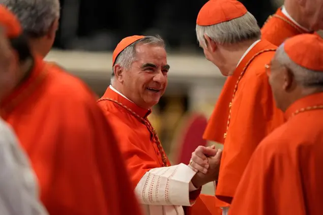 Cardinal Angelo Becciu attends the consistory inside St. Peter's Basilica, at the Vatican, Saturday, Aug. 27, 2022. Pope Francis has chosen 20 men to become the Catholic Church's newest cardinals. (AP Photo/Andrew Medichini)