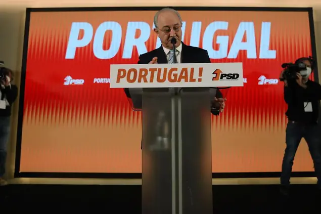 Rui Rio, leader of the center-right Social Democratic Party pauses as he addresses supporters following election results in which Portugal's center-left Socialist Party won a third straight general election, returning it to power, Lisbon, Monday, Jan. 31, 2022. Portuguese voters went to the polls Sunday, two years earlier than scheduled after a political crisis over a blocked spending bill brought down the country's minority Socialist government and triggered a snap election. (AP Photo/Ana Brigida)
