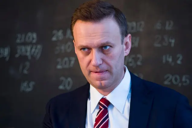 FILE - In this Monday, Dec. 18, 2017 file photo, Russian opposition politician Alexei Navalny speaks to journalists prior to his interview to the Associated Press at the Anti-Corruption Foundation (FBK) in Moscow, Russia. Navalny on Monday, July 20, 2020 announced the closure of his non-profit Anti-Corruption Foundation (FBK) over the court's order to pay massive damages in a controversial lawsuit, but said it would reopen under a new name. (AP Photo/Alexander Zemlianichenko, File)