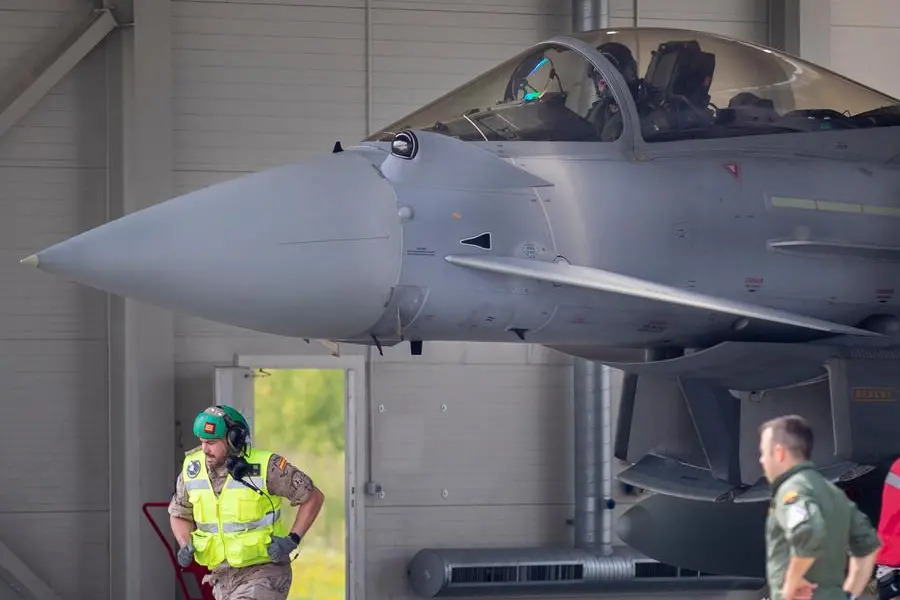 Spain's Eurofighter Typhoon jet fighter pilot prepares for take off during NATO's Baltic Air Policing Mission during the Lithuania's President Gitanas Nauseda and Spain's Prime Minister Pedro Sanchez visit at the Siauliai military air force base some 220 kms (136,7 miles) east of the capital Vilnius, Lithuania, Thursday, July 8, 2021. (AP Photo/Mindaugas Kulbis)