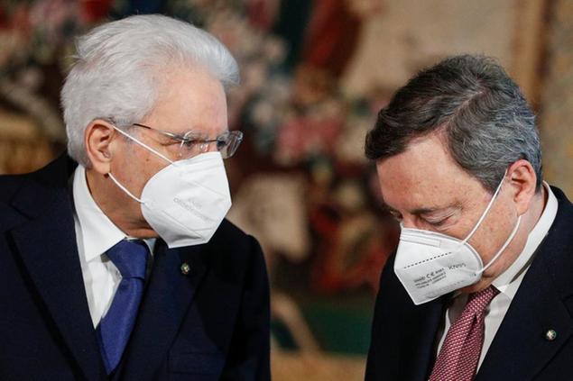 Italian President Sergio Mattarella, left, and Premier Mario Draghi after the swearing-in ceremony, at the Quirinale Presidential Palace in Rome, Saturday, Feb. 13, 2021. Mario Draghi, credited with largely saving the euro currency, has formally taken the helm of Italy, focused on guiding the country through the pandemic and reviving its economy. Premier Draghi and his Cabinet ministers were sworn into office Saturday at the Quirinal presidential palace in front of President Sergio Mattarella. (Guglielmo Mangiapane/Pool photo via AP)