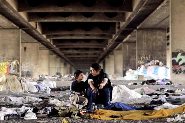 Two Gypsy boys sell second hand items under a railway bridge in Belgrade, Serbia, Monday, Oct. 15, 2007. About 80 percent of Gypsy children in Serbia enroll in the obligatory primary schools, but only 20 percent actually graduate, according to the UNICEF mission in Belgrade. (AP Photo/Marko Drobnjakovic)