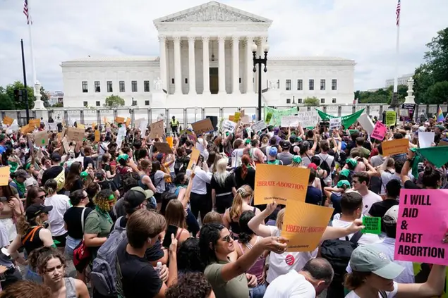 EDS NOTE: OBSCENITY - Protesters gather outside the Supreme Court in Washington, Friday, June 24, 2022. The Supreme Court has ended constitutional protections for abortion that had been in place nearly 50 years, a decision by its conservative majority to overturn the court's landmark abortion cases. (AP Photo/Jacquelyn Martin)