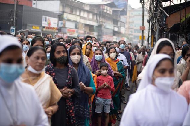 FILE - Indian Christians wearing masks as a precaution against COVID-19 gather for prayers as they observe Palm Sunday in Kochi, Kerala state, India, April 10, 2022. The quickly changing coronavirus has spawned yet another super contagious omicron mutant that's worrying scientists as it gains ground in India and pops up in numerous other countries, including the United States. Scientists say the variant, which is called BA.2.75, may be able to spread rapidly and get around immunity from vaccines and previous infection. (AP Photo/R S Iyer, File)