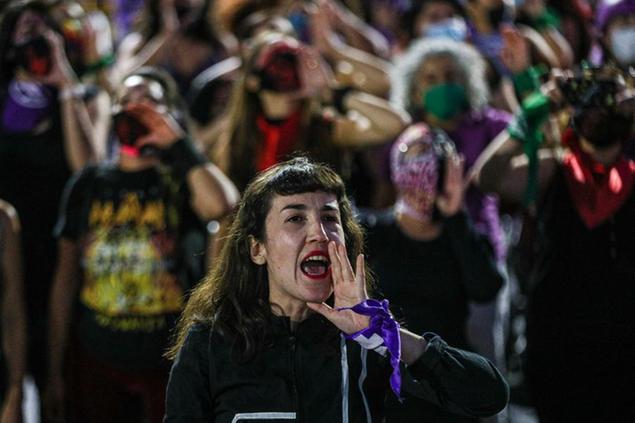 The feminist group known as Las Tesis, perform \\\\\\\"Un Violador en tu Camino\\\\\\\" or A rapist in your path, in a demonstration against gender-based violence during a march marking the International Day for Elimination of Violence against Women, in Santiago, Chile, Wednesday, Nov. 25, 2020. (AP Photo/Esteban Felix)