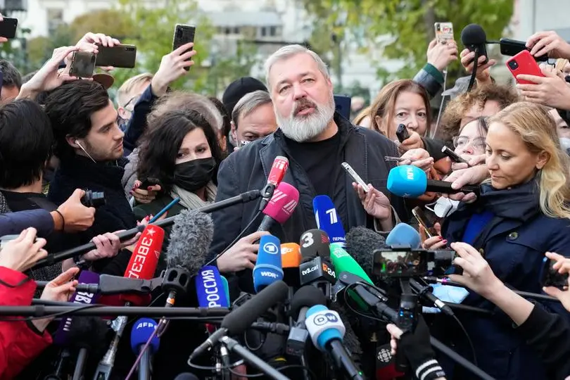 Novaya Gazeta editor Dmitry Muratov talks to media at the Novaya Gazeta newspaper, in Moscow, Russia, Friday, Oct. 8, 2021. As a new Nobel Peace Prize laureate, Russian newspaper editor Dmitry Muratov has downplayed the buzz around his name. The award isn't for him, he says, but for all of the staff at Novaya Gazeta, the independent Russian newspaper noted for investigations of official corruption, human rights abuses and Kremlin criticism (AP Photo/Alexander Zemlianichenko)