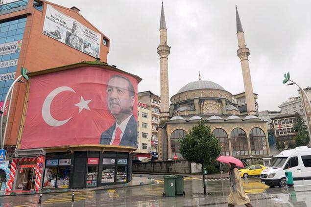 Photo taken Dec. 18, 2021, shows a picture of Turkish President Recep Tayyip Erdogan put up in Rize, northeastern Turkey. (Kyodo via AP Images) ==Kyodo