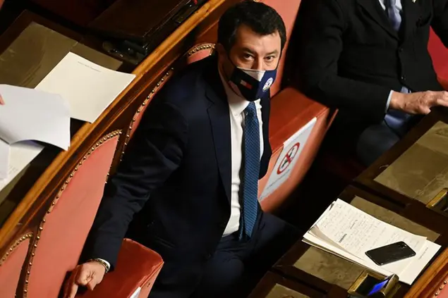 The League right-wing party leder Matteo Salvini listens to Italian Premier Giuseppe Conte as he address the Senate, in Rome, Tuesday, Jan. 19, 2021. Conte fights for his political life with an address aimed at shoring up support for his government, which has come under fire from Renzi's tiny but key party over plans to relaunch the pandemic-ravaged economy. (Andreas Solaro/Pool via AP)