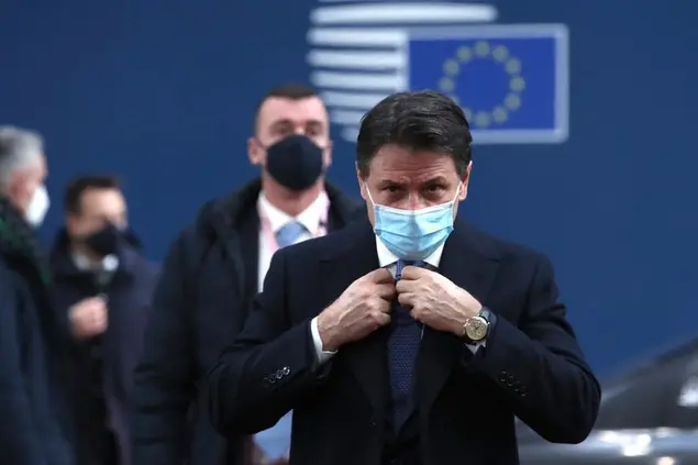 Italy's Prime Minister Giuseppe Conte arrives for an EU summit at the European Council building in Brussels, Thursday, Dec. 10, 2020. European Union leaders meet for a year-end summit that will address anything from climate, sanctions against Turkey to budget and virus recovery plans. Brexit will be discussed on the sidelines. (Yves Herman, Pool via AP)