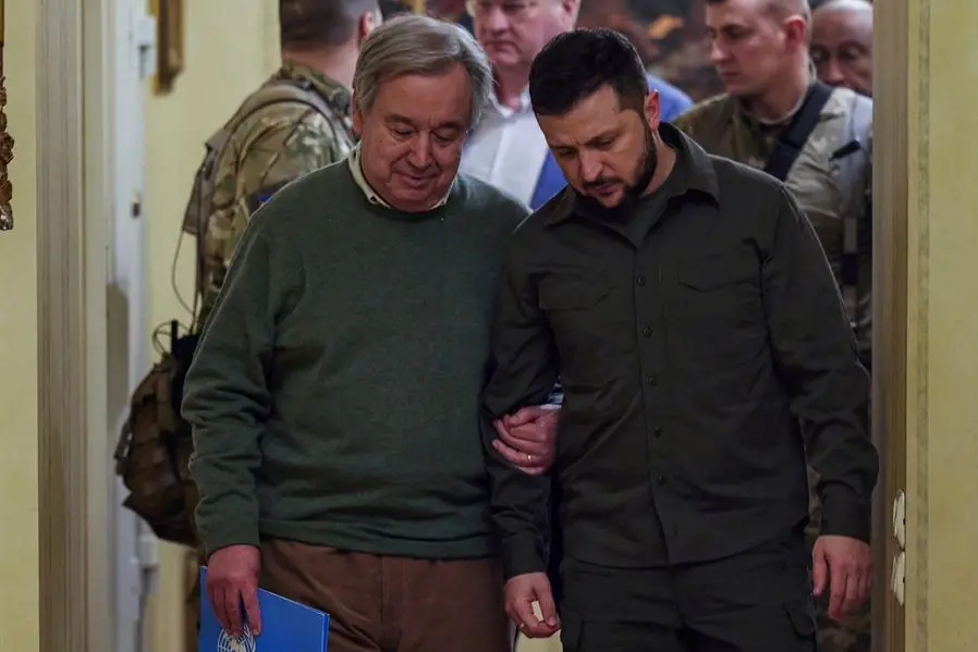 In this image provided by the Ukrainian Presidential Press Office, Ukrainian President Volodymyr Zelenskyy, right, and U.N. Secretary-General Antonio Guterres leave a news conference during their meeting in Kyiv, Ukraine, Thursday, April 28, 2022. (Ukrainian Presidential Press Office via AP)