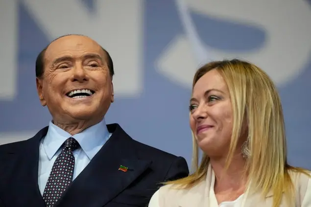 Forza Italia party leader Silvio Berlusconi, left and Brothers of Italy party leader Giorgia Meloni attend the center-right coalition closing rally in Rome, Sept. 22, 2022. (AP Photo/Gregorio Borgia)