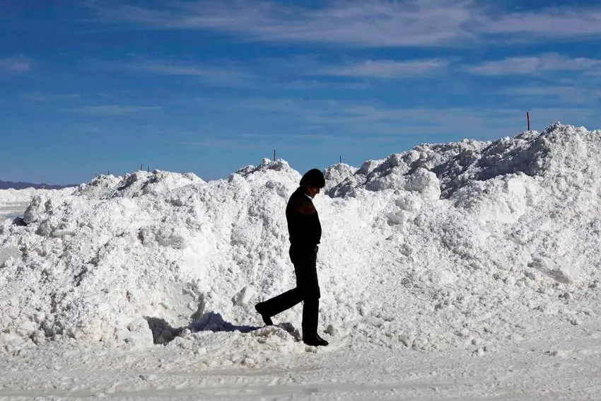 Bolivia's President Evo Morales tours a semi-industrial plant to produce potassium chloride, used to manufacture batteries based on lithium, before its opening ceremony at the Uyuni salt desert, outskirts of Llipi, Bolivia, Thursday, Aug. 9, 2012. The salt flats of Uyuni have triggered international interest among energy companies due to its lithium reserves. (AP Photo/Juan Karita)