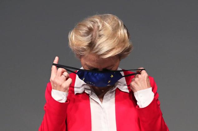 European Commission President Ursula von der Leyen removes her face mask before delivering a speech on the EU's coronavirus recovery fund plan at the Campalimaud Foundation in Lisbon, Tuesday, Sept. 29, 2020. (AP Photo/Pedro Rocha)