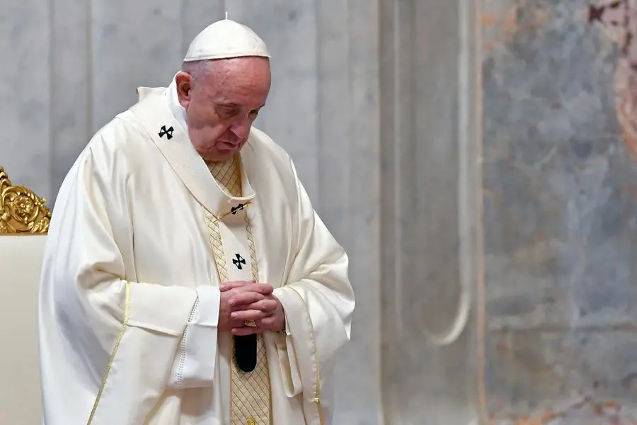 Pope Francis attends a Mass for Holy Thursday, inside St. Peter\\\\'s Basilica at the Vatican, Thursday, April 9, 2020. Francis celebrated the Holy Week Mass in St. Peter\\\\'s Basilica, which was largely empty of faithful because of restrictions aimed at containing the spread of COVID-19. The new coronavirus causes mild or moderate symptoms for most people, but for some, especially older adults and people with existing health problems, it can cause more severe illness or death. (Alessandro Di Meo/Pool Photo via AP)