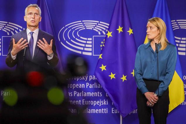 NATO Secretary General Jens Stoltenberg, left, and European Parliament President Roberta Metsola deliver a statement to the media prior to a meeting at the European Parliament in Brussels, Thursday, April 28, 2022. (AP Photo/Olivier Matthys)