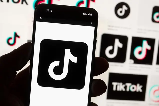 FILE - The TikTok logo is seen on a cell phone on Oct. 14, 2022, in Boston. The Kentucky Senate passed a measure Friday, Feb. 10, 2023, to ban TikTok from state government-issued devices, reflecting bipartisan concerns about the Chinese-owned social media app. (AP Photo/Michael Dwyer, File)