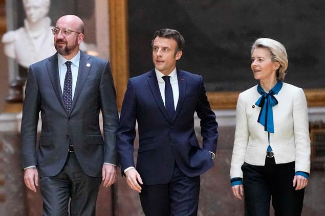 President of the European Council Charles Michel, left, French President Emmanuel Macron and European Commission President Ursula von der Leyen arrive for a press conference after the EU summit at the Chateau de Versailles, Friday, March 11, 2022 in Versailles, west of Paris. The European Union says it will continue applying pressure on Russia by devising a new set of sanctions to punish Moscow for its invasion of Ukraine while stepping up military support for Kyiv. (AP Photo/Michel Euler)