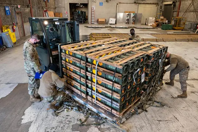FILE - In this image provided by the U.S. Air Force, Airmen and civilians from the 436th Aerial Port Squadron palletize ammunition, weapons and other equipment bound for Ukraine during a foreign military sales mission at Dover Air Force Base, Del., on Jan. 21, 2022. Western weaponry pouring into Ukraine helped blunt Russia's initial offensive and seems certain to play a central role in the approaching battle for Ukraine's contested Donbas region. Yet the Russian military is making little headway halting what has become a historic arms express. (Mauricio Campino/U.S. Air Force via AP)