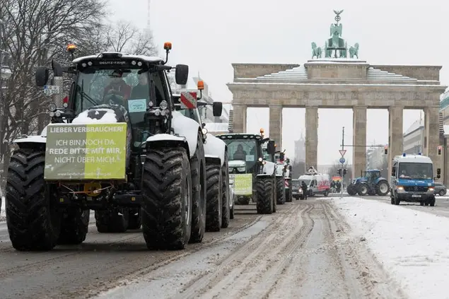 09 February 2021, Berlin: Several dozen farmers demonstrate at the Brandenburg Gate with tractors for a change of course in agricultural policy. On the tractors are placards with different inscriptions, such as \\\"Dear consumer! I am still here. Please talk to me, not about me.\\\" An insect protection law is turning farmers and states against Berlin. Photo by: Gregor Bauernfeind/picture-alliance/dpa/AP Images