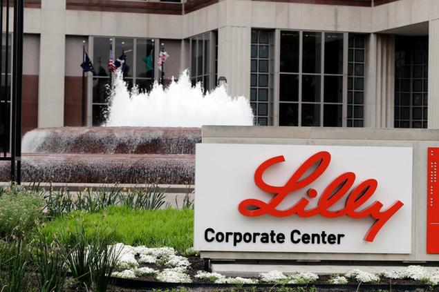 FILE- In this April 26, 2017, file photo shows the Eli Lilly and Co. corporate headquarters in Indianapolis. Eli Lilly\\u00E2\\u20AC\\u2122s new COVID-19 treatment helped the drugmaker\\u00E2\\u20AC\\u2122s fourth-quarter profit surge even though U.S. regulators approved its use late in the quarter. The antibody treatment bamlanivimab brought in $871 million in sales for Lilly after the Food and Drug Administration authorized emergency use in November 2020 for patients with mild-to-moderate COVID-19. . (AP Photo/Darron Cummings, File)