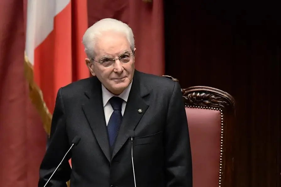 Newly re-elected Italian President Sergio Mattarella stands during his swearing-in ceremony in the Italian parliament in Rome, Thursday, Feb. 3, 2022. (Filippo Monteforte/Pool photo via AP)