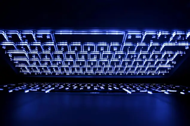 09 April 2019, Hessen, R'sselsheim: LLUSTRATION - The illuminated keyboard of a laptop is reflected on the screen. Photo by: Silas Stein/picture-alliance/dpa/AP Images