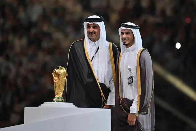 From left: Emir Sheikh Tamim bin Hamad Al Thani . and his brother pose behind the trophy, cup, trophy. Game 64, FINAL Argentina - France 4-2 nE (3-3) on December 18th, 2022, Lusail Stadium Football World Cup 20122 in Qatar from November 20th. - 18.12.2022 ? Photo by: Frank Hoermann/SVEN SIMON/picture-alliance/dpa/AP Images