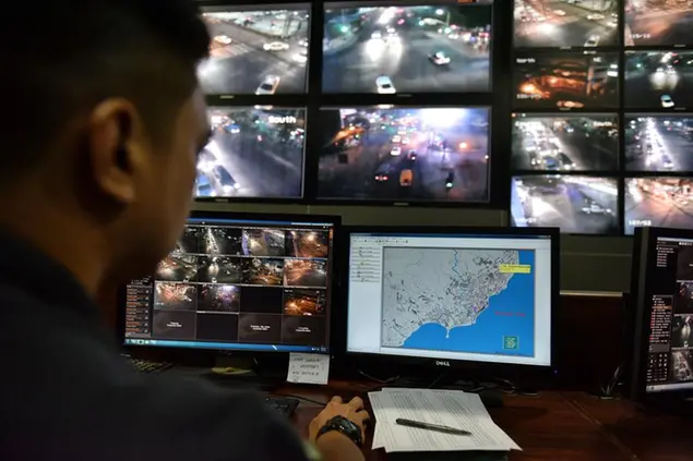 DAVAO CITY, PHILIPPINES - MAY 08: A public safety and security officer watches camera feeds monitoring Davao city on May 8, 2016 in Davao City, Mindanao, Philippines. A city of nearly two million, Davao is a diverse city in the Philippine southern island of Mindanao where presidential candidate Rodrigo Duterte served as mayor for 22 years. Although claimed to be one of the safest cities in the world after the efforts of the mayor, human rights activists continue to protest the rampant extra judicial killings by a secret death squad linked to the mayor that has killed more than a thousand people. (Photo by Jes Aznar/Getty Images)