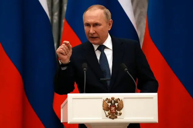 Russian President Vladimir Putin gestures during a joint press conference with French President Emmanuel Macron after their talks Monday, Feb. 7, 2022 in Moscow. Russian President Vladimir Putin was back at the Kremlin in Moscow following his diplomatic foray to get support from China over the weekend during the Winter Olympics. Putin was hosting the prime meeting of the day Monday as his French counterpart Emmanuel Macron was on a mission to de-escalate tensions. (AP Photo/Thibault Camus, Pool)
