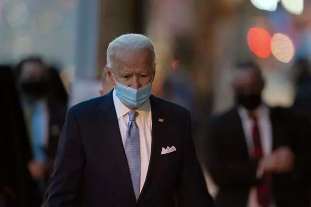 President-elect Joe Biden walks to speak to the media as he leaves The Queen theater, Tuesday, Nov. 24, 2020, in Wilmington, Del. (AP Photo/Carolyn Kaster)