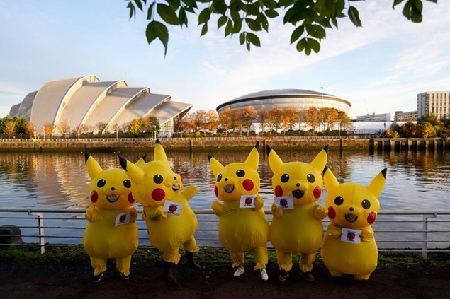 Activists dressed as the Pokemon character Pikachu protest against the Japan\\\\'s use of coal near the COP26 U.N. Climate Summit in Glasgow, Scotland, Thursday, Nov. 4, 2021. The U.N. climate summit in Glasgow gathers leaders from around the world, in Scotland\\\\'s biggest city, to lay out their vision for addressing the common challenge of global warming. (AP Photo/Alberto Pezzali)
