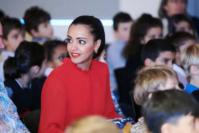 13 December 2019, Berlin: Sawsan Chebli (SPD), State Secretary for Citizenship and International Affairs in the Berlin Senate Chancellery, sits with many pupils as a guest in a school performance. Photo by: Annette Riedl/picture-alliance/dpa/AP Images