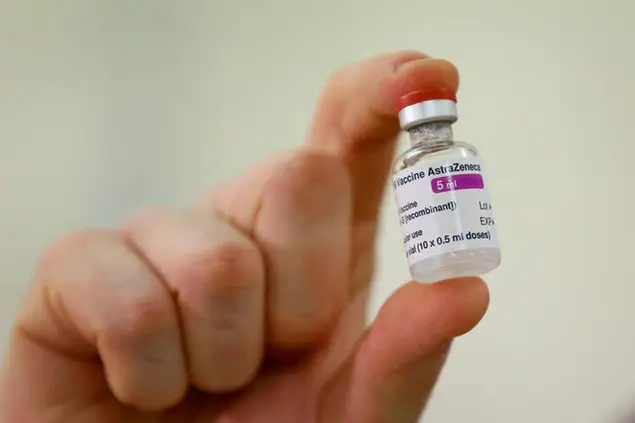 A vial of the COVID-19 vaccine developed by Oxford University and U.K.-based drugmaker AstraZeneca is checked as they arrive at the Princess Royal Hospital in Haywards Heath, England, Saturday Jan. 2, 2021. The UK has 530,000 doses available for rollout from Monday. (Gareth Fuller/Pool via AP)