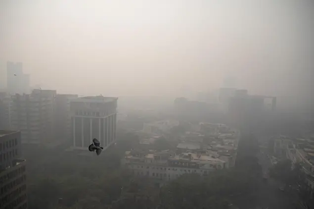 Smog envelopes the skyline in New Delhi, India, Wednesday, Nov. 4, 2020. A thick quilt of smog lingered over the Indian capital and its suburbs on Friday, fed by smoke from raging agricultural fires that health experts worry could worsen the cityâ€™s fight against the coronavirus. Air pollution in parts of New Delhi have climbed to levels around nine times what the World Health Organization considers safe, turning grey winter skies into a putrid yellow and shrouding national monuments. (AP Photo/Altaf Qadri)