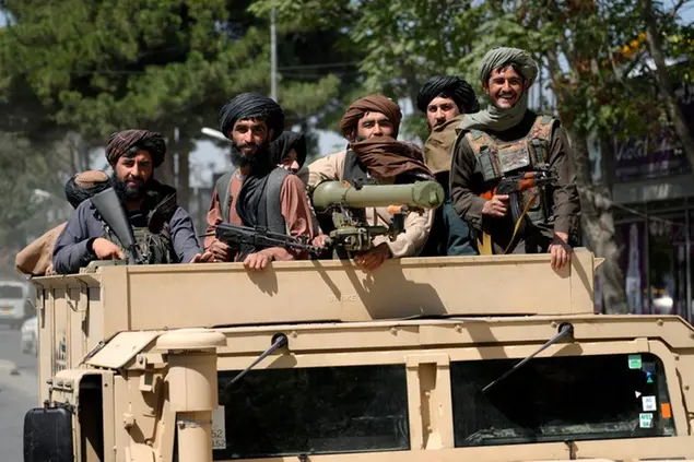 Taliban fighters celebrate the first anniversary of the withdrawal of US-led troops from Afghanistan, in Kabul, Afghanistan, Wednesday, Aug. 31, 2022. (AP Photo/Ebrahim Noroozi)