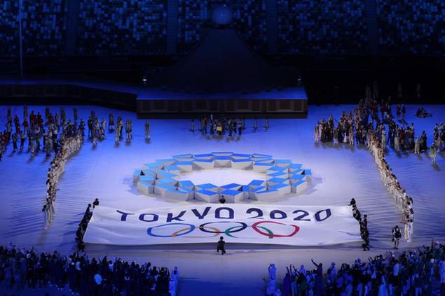23 July 2021, Japan, Tokio: Olympics: Opening ceremony at the Olympic Stadium. Athletes stand around the \\\"Tokyo 2020 Harmonised Chequered Emblem\\\" after the parade. Photo by: Jan Woitas/picture-alliance/dpa/AP Images