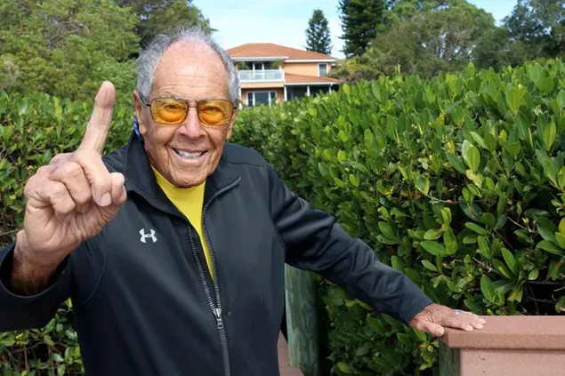 FILE - Tennis coach Nick Bollettieri gestures outside his home Thursday, Jan. 7, 2021, in Bradenton, Fla. Nick Bollettieri, the Hall of Fame tennis coach who worked with some of the sportâ€™s biggest stars, and founded an academy that revolutionized the development of young athletes, has died. He was 91. Bollettieri passed away Sunday night, Dec. 4, 2022, at home in Florida after a series of health issues, his manager, Steve Shulla, said in a telephone interview with The Associated Press on Monday. (James A. Jones Jr./The Bradenton Herald via AP, File)