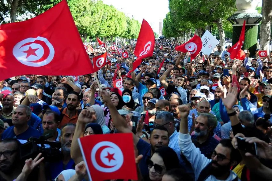 People take part in a demonstration by the National Salvation Front against President Kais SaÃ¯ed at Avenue Habib Bourguiba in Tunis, Tunisia, Saturday Oct. 15, 2022.(AP Photo/Hassene Dridi)