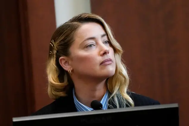 Actor Amber Heard testifies in the courtroom at the Fairfax County Circuit Court in Fairfax, Va., Wednesday May 4, 2022. Actor Johnny Depp sued his ex-wife Heard for libel in Fairfax County Circuit Court after she wrote an op-ed piece in The Washington Post in 2018 referring to herself as a \\\"public figure representing domestic abuse.\\\" (Elizabeth Frantz/Pool Photo via AP) Actor Amber Heard testifies in the courtroom at the Fairfax County Circuit Court in Fairfax, Va., Wednesday May 4, 2022. Actor Johnny Depp sued his ex-wife Heard for libel in Fairfax County Circuit Court after she wrote an op-ed piece in The Washington Post in 2018 referring to herself as a \\\"public figure representing domestic abuse.\\\" (Elizabeth Frantz/Pool Photo via AP) Actor Amber Heard listens as she testifies at Fairfax County Circuit Court during a defamation case against her by ex-husband, actor Johnny Depp, in Fairfax, Virginia, U.S., May 4, 2022. REUTERS/Elizabeth Frantz/Pool