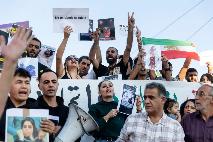 Protesters shout slogans during a protest against the death of Iranian Mahsa Amini, at central Syntagma square, in Athens, Greece, Saturday, Sept. 24, 2022. The 22-year-old woman, who died in Iran while in police custody, was arrested by Iran's morality police for allegedly violating its strictly-enforced dress code. (AP Photo/Yorgos Karahalis)
