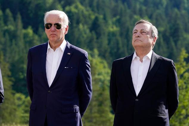 U.S. President Joe Biden stands beside Mario Draghi, Prime Minister of Italy, as others speak about the global infrastructure partnership, on the margins of the G7 Summit in Elmau, Germany, Sunday, June 26, 2022. (AP Photo/Susan Walsh)