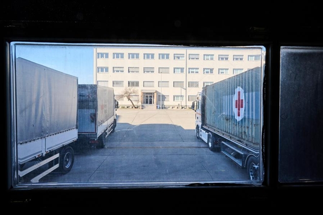 01 March 2022, Berlin: Trucks are parked at the logistics center of the German Red Cross (DRK) and are loaded with relief supplies. The relief supplies are being trucked to Poland, where they will be distributed to Ukrainians fleeing their homes as well as to people in Ukraine itself. In view of the fighting in Ukraine, more and more Ukrainians are fleeing to neighboring countries. Photo by: Annette Riedl/picture-alliance/dpa/AP Images