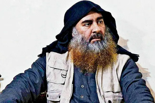 FILE - This file image released by the Department of Defense on Wednesday, Oct. 30, 2019, and displayed at a Pentagon briefing, shows an image of Islamic State leader Abu Bakr al-Baghdadi. The Islamic State group seemed largely defeated last year, with the loss of its territory, the killing of its founder in a U.S. raid and an unprecedented crackdown on its social media propaganda machine but tensions between the U.S. and Iran in the region provide a comeback opportunity for the extremist group. (Department of Defense via AP, File)