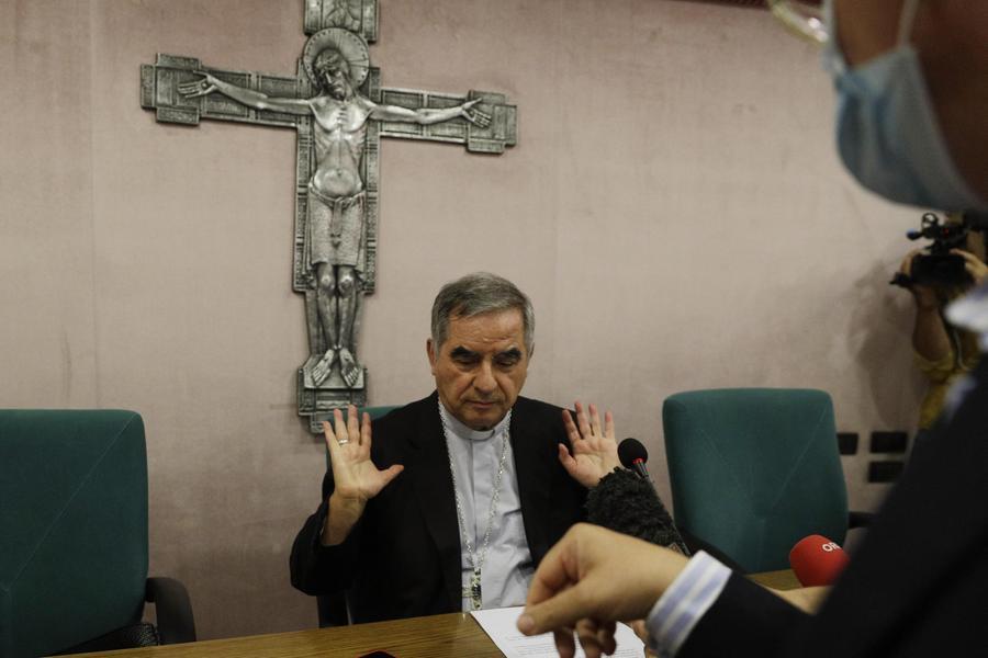 FILE - In this Sept. 25, 2020 Cardinal Angelo Becciu talks to journalists during a press conference in Rome. Italy\\u2019s financial police said Wednesday, Oct. 14, 2020 that a Sardinian woman, Cecilia Marogna, said to be close to one of the Holy See\\u2019s most powerful cardinals, Becciu, before his downfall, was arrested in Milan, northern Italy, late Tuesday on an international warrant issued by the Vatican City State. (AP Photo/Gregorio Borgia, file)